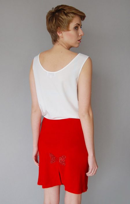 Wełniana spódniczka z cekinową kokardą